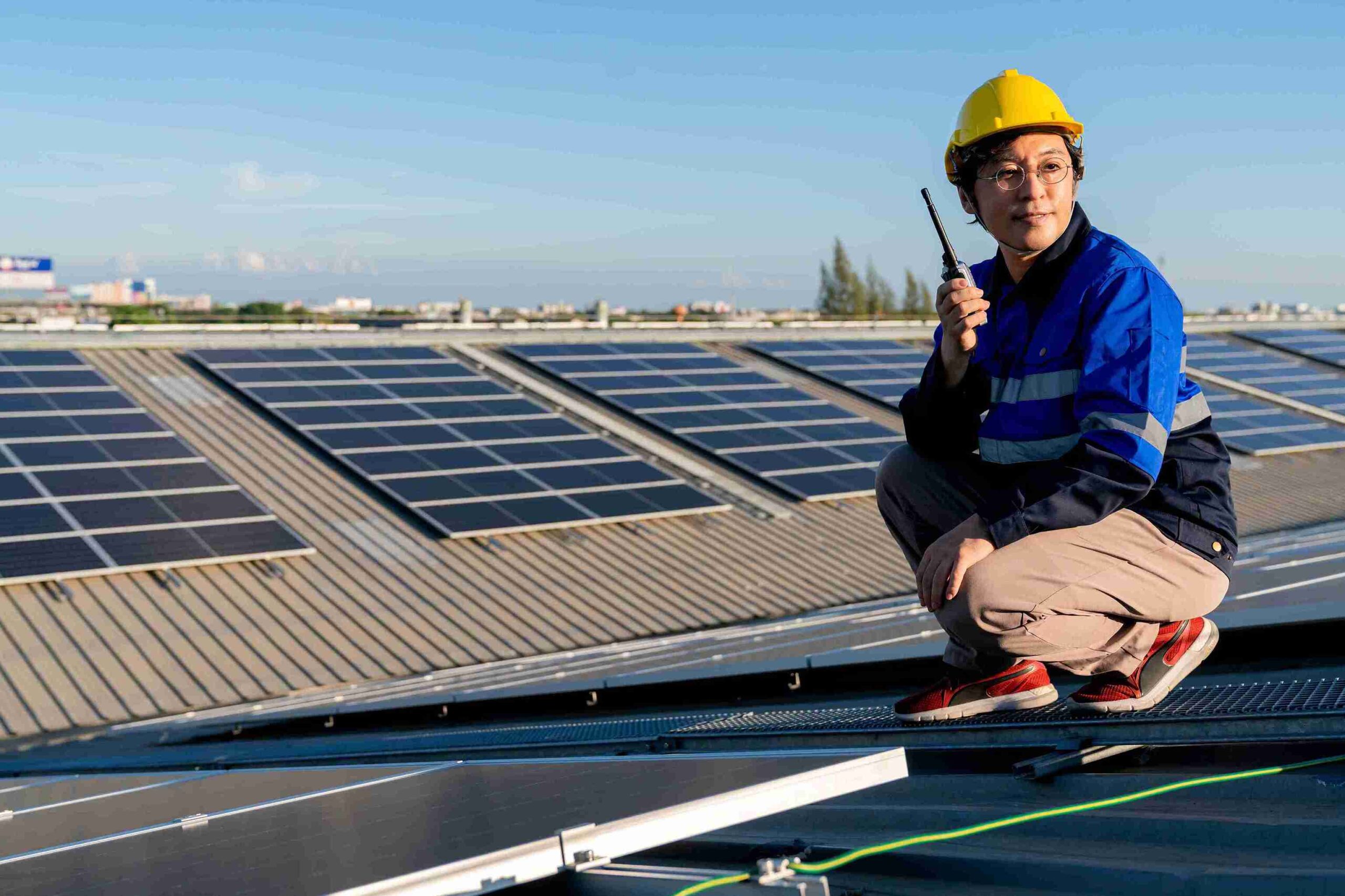 professional checking the solar panels