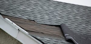 missing asphalt shingles on a roof edge