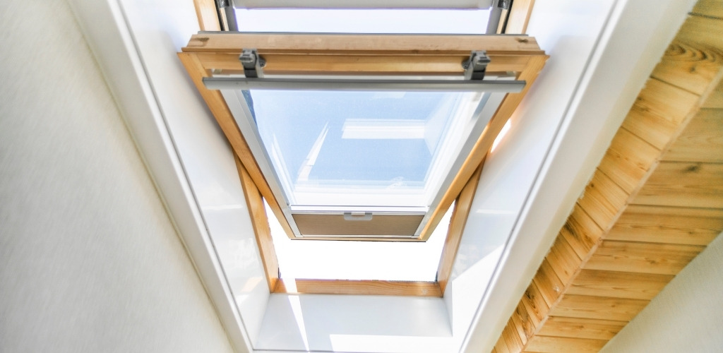 skylight installed on an angled attic ceiling